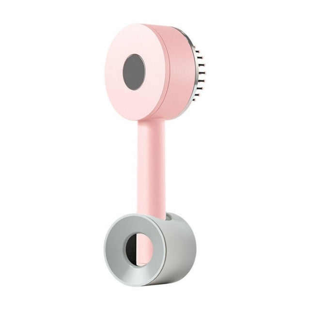 massaging brush with loose thread ejector