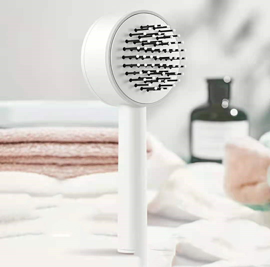 brosse de massage avec éjecteur de fil libre