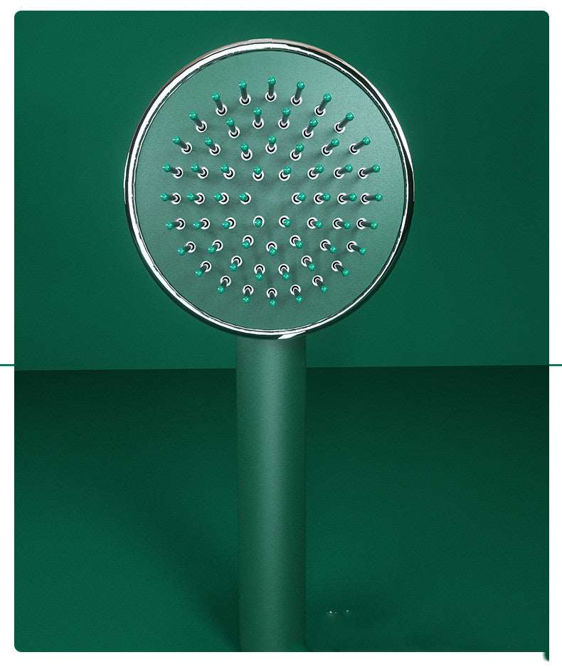 massaging brush with loose thread ejector