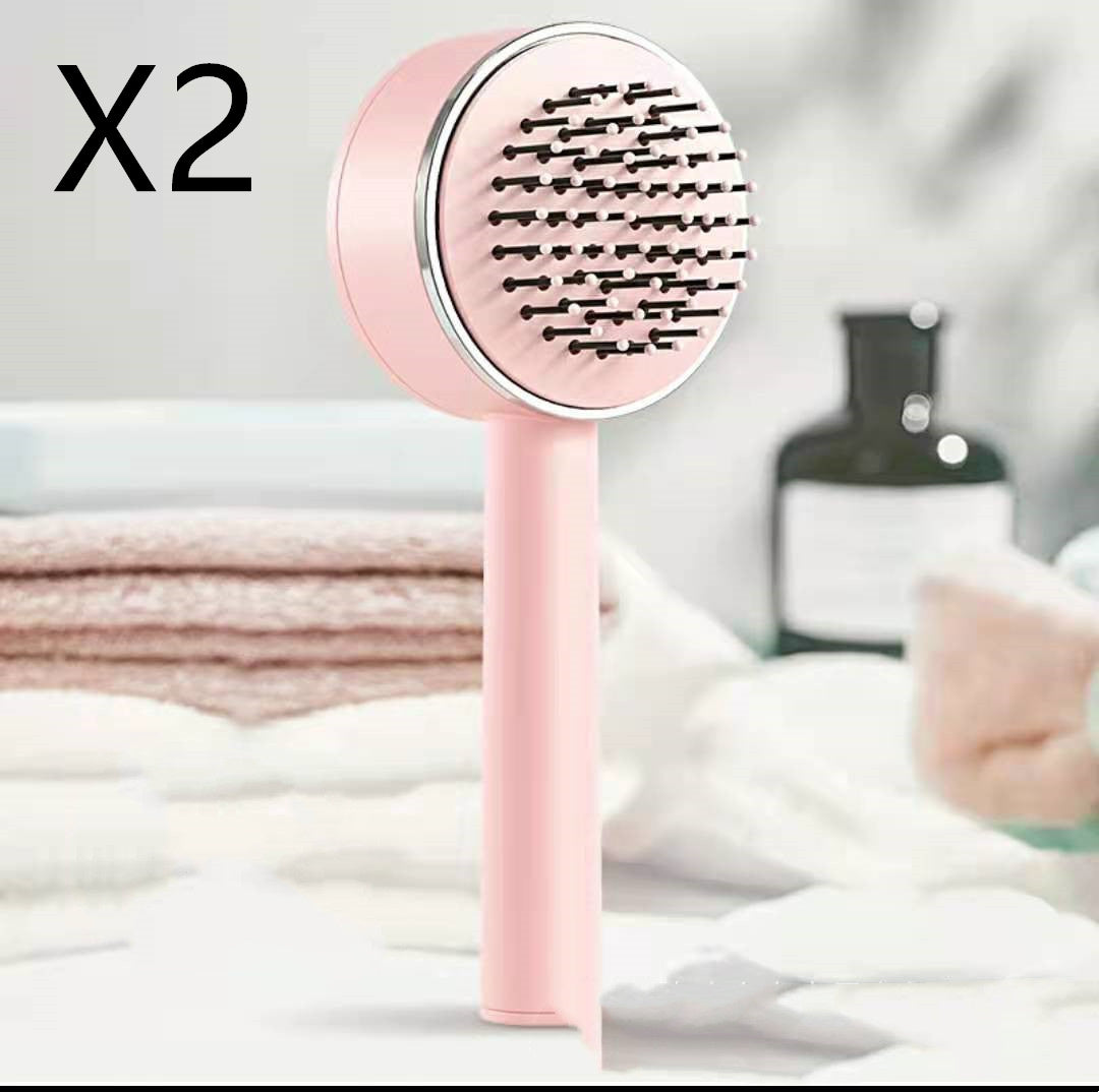 massaging brush with loose thread ejector