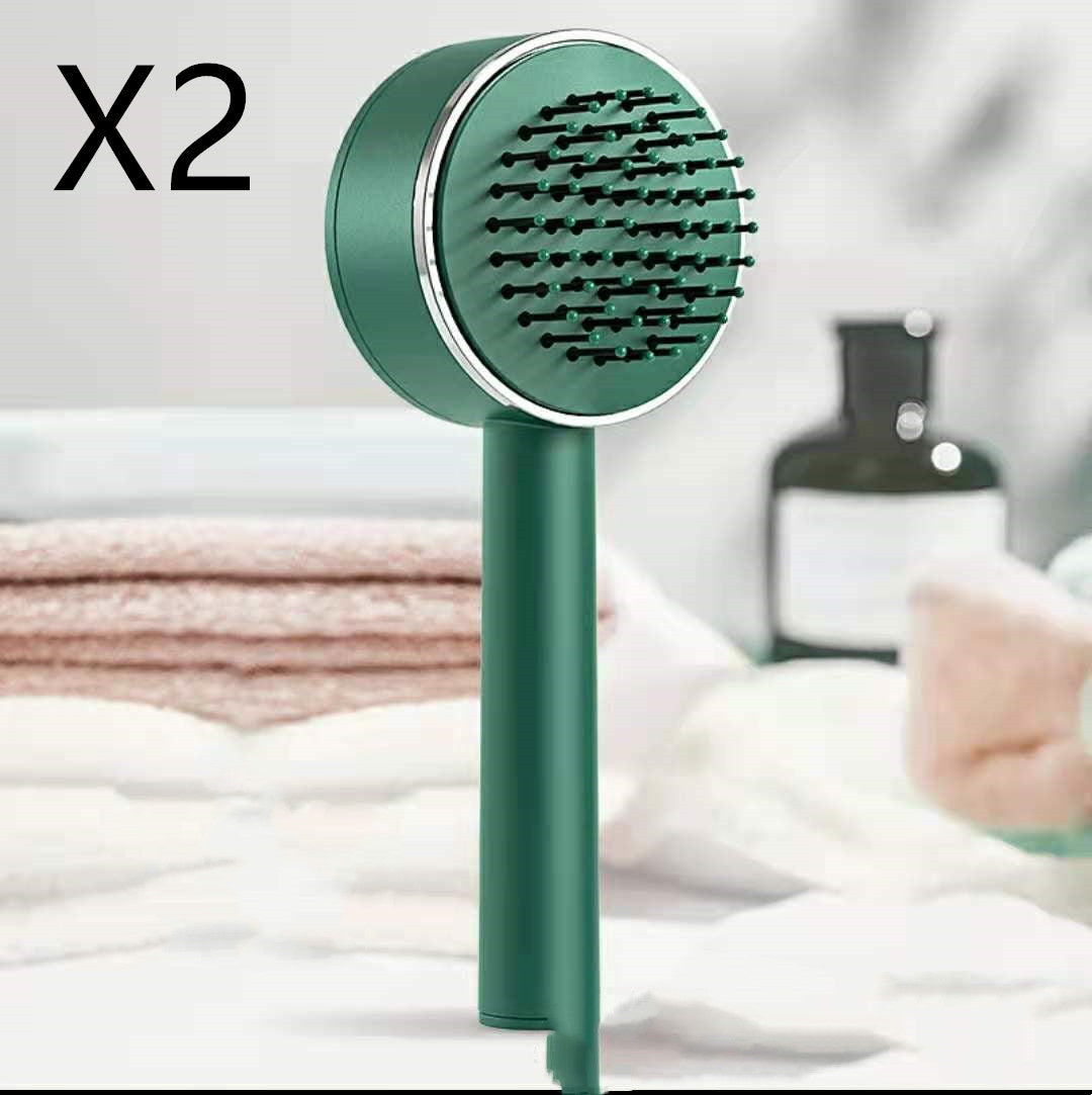 massaging brush with loose thread ejector